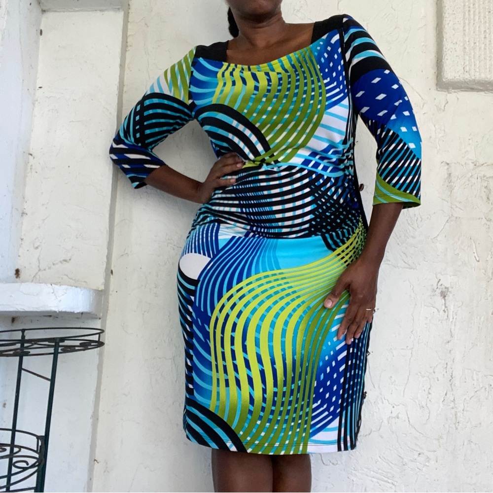 Nueva Graphic Print Neon and Black Rouching Side Button Dress!